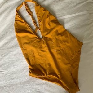 Plunging V-neck gold bodysuit